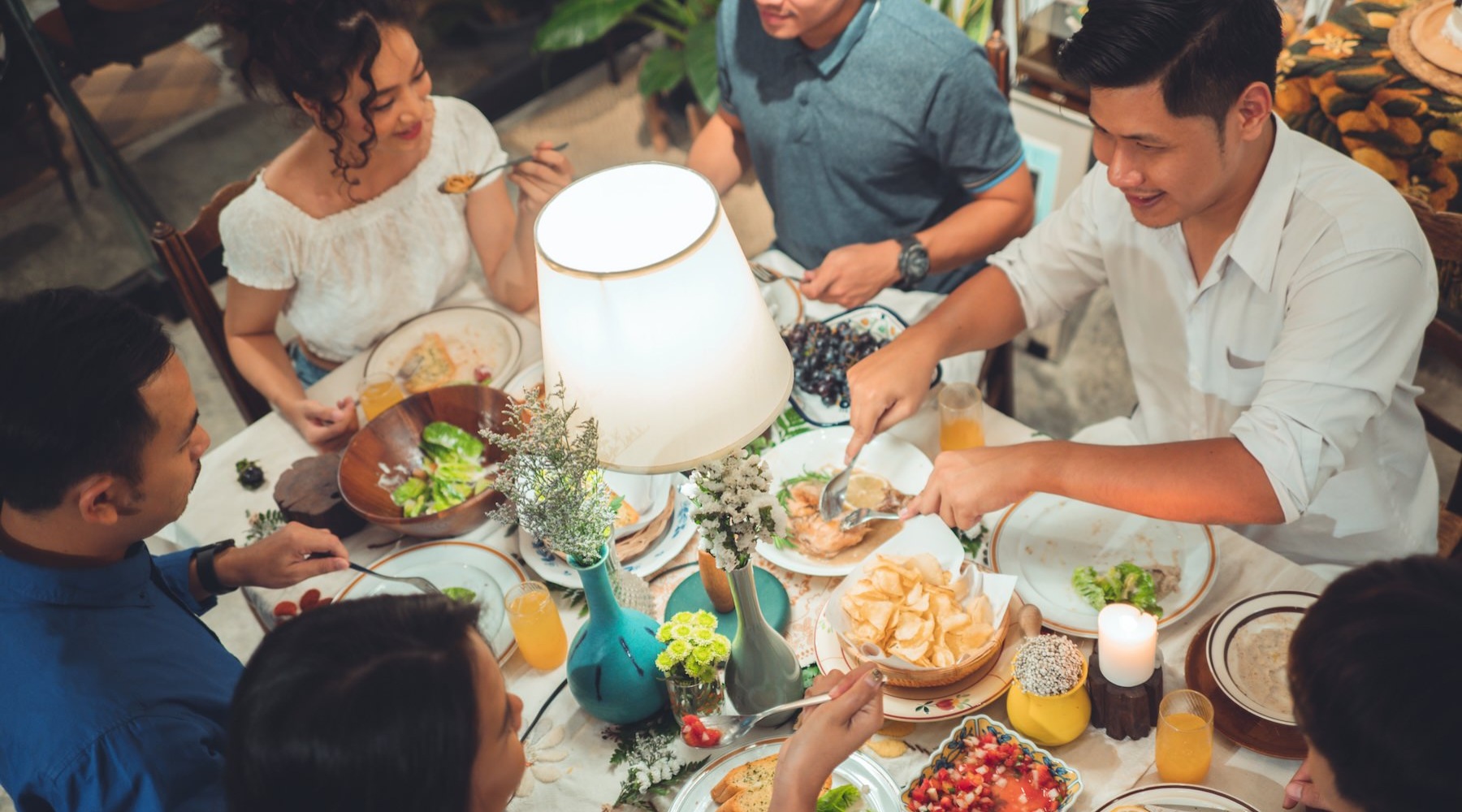 a group of people having a meal together